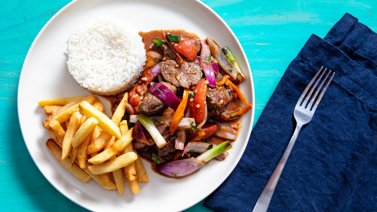 Lomo Saltado (Peruvian Stir-Fried Beef With Onion, Tomatoes, and French Fries)